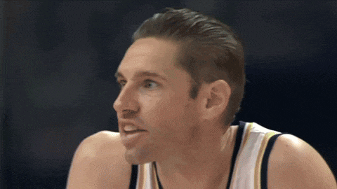 a close up of a basketball player 's face with a blue background