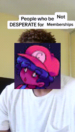a man wearing a white shirt has a picture of a girl in a red hat on his face