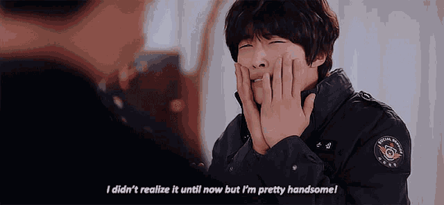 a man with his hands on his face says i didn 't realize it until now but i m pretty handsome
