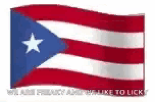 a red , white , and blue flag with a white star on it is waving in the wind .