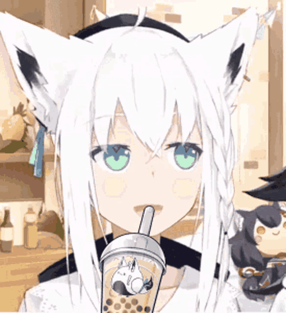 a girl with white hair and green eyes is drinking a bubble tea .
