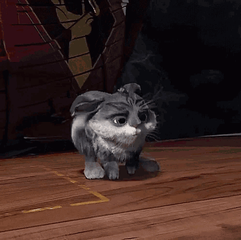 a cartoon rabbit sitting on a wooden floor