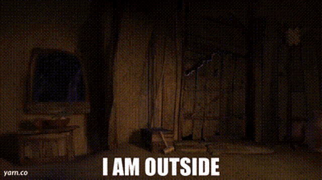 a person is sitting in a chair with the words `` i am outside '' written on the bottom of the screen .