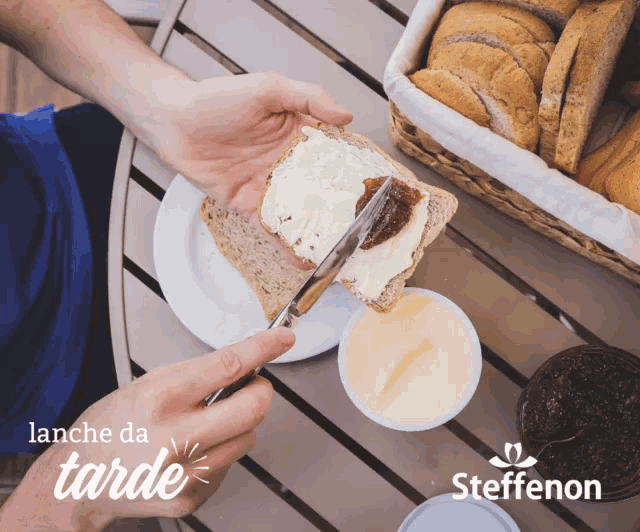 a person is spreading butter on a slice of bread with a knife