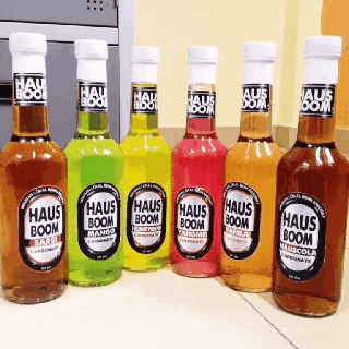 six bottles of haus boom sit on a counter