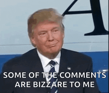 donald trump is wearing a suit and tie and smiling .