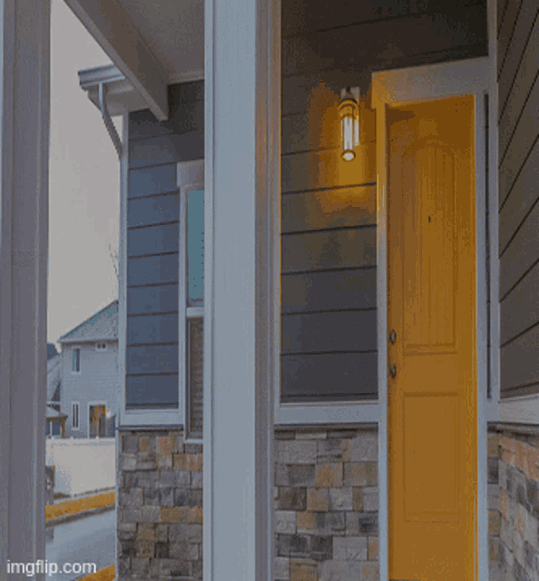 a gray house with a white roof and a porch with imgflip.com written on the bottom