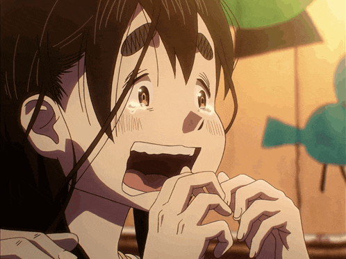 a close up of a girl 's face with her mouth wide open