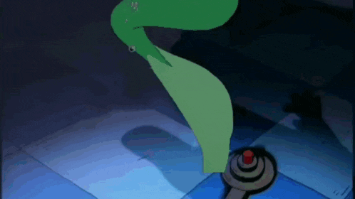 a green snake is crawling on a blue tile floor