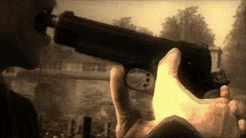a man is holding a gun in his hand in front of a crowd of people .