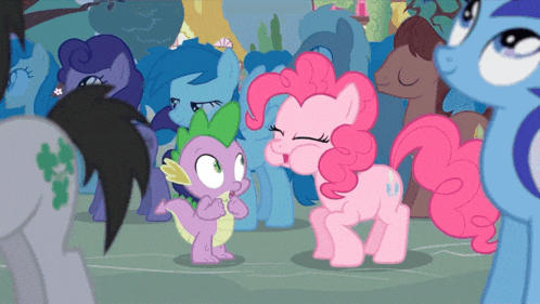 a group of ponies including pinkie pie and spike are gathered together