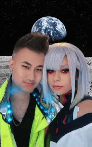 a man and a woman are posing for a picture in front of the earth