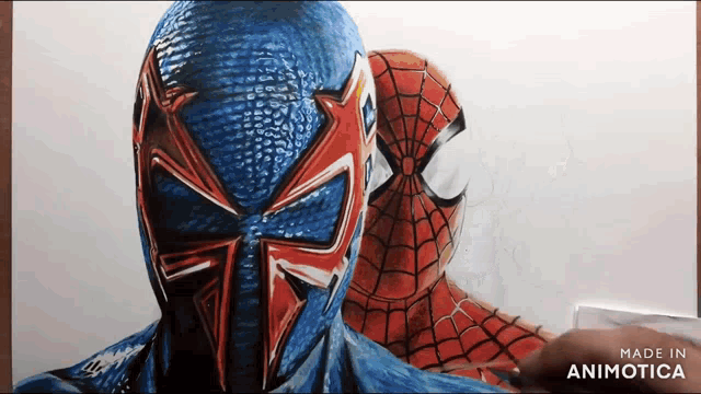 a drawing of a blue and red spiderman is being made by animatica