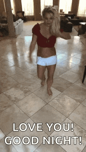 a woman in a red top and white shorts is walking on a tiled floor with the words " love you good night " above her