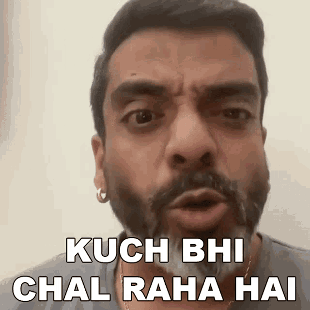 a man with a beard is making a funny face and says kuch bi chal raha hai