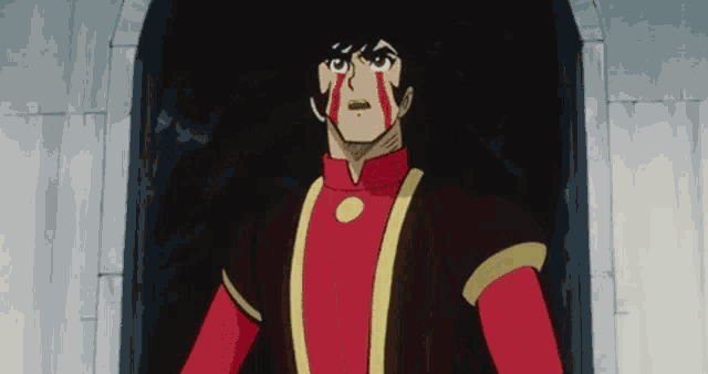 a man in a red and gold outfit is standing in a doorway