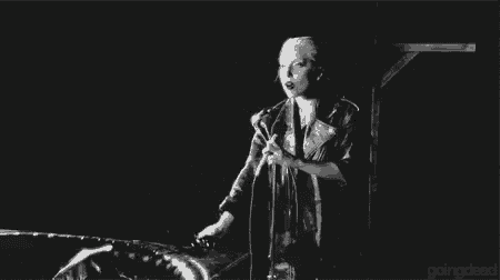 a black and white photo of a woman singing into a microphone with the words `` deal with it '' .