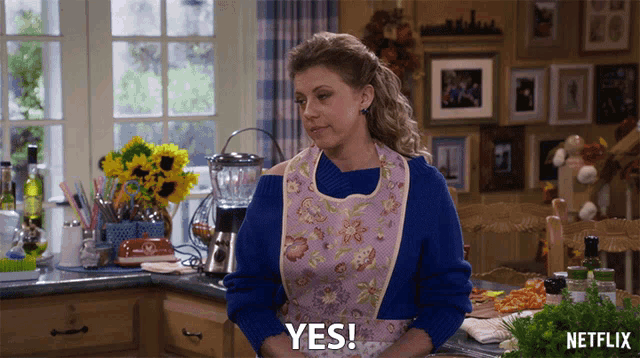 a woman in an apron says yes in front of a netflix logo
