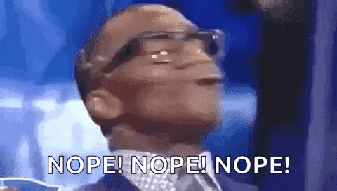a man wearing glasses and a suit is saying nope .