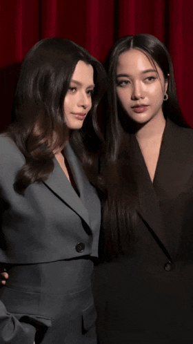 a couple of women standing next to each other