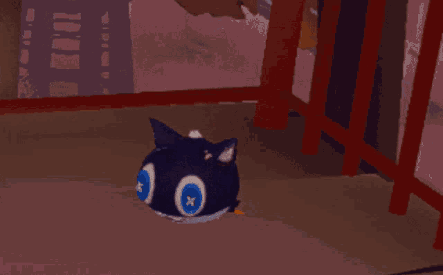 a cartoon cat with a blue eye is standing on a brown floor