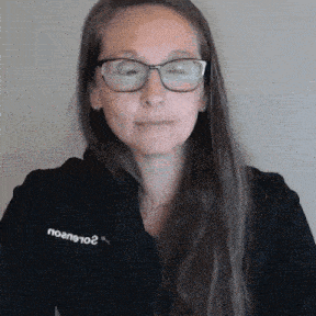 a woman wearing glasses and a black shirt that says " noano102 "