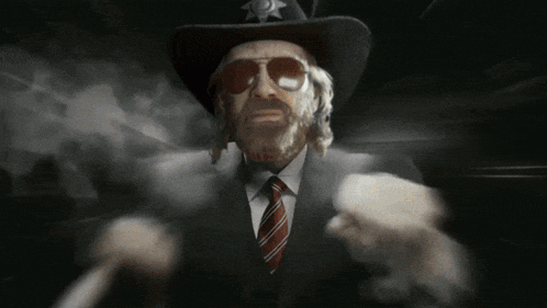a man wearing a cowboy hat and sunglasses