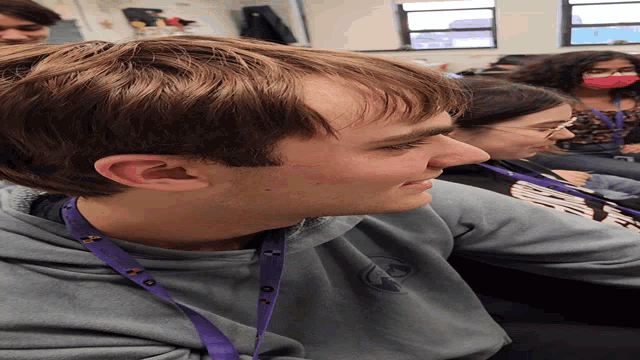 a man with a lanyard around his neck that says ' ucsd '