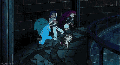 a group of cartoon characters are standing in a dark room and one of them has a r on her shirt