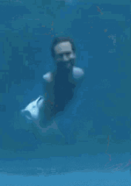 a painting of a person swimming under water