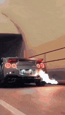 a car with a license plate that says gtxram is driving down a road