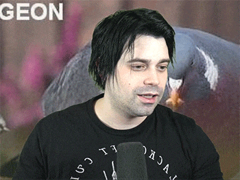 a man wearing a black shirt that says geon