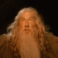 a man with long hair and a beard is making a face .