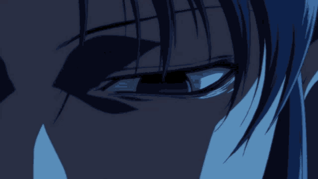 a close up of a person 's face with a blue background