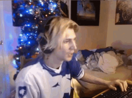 a man wearing headphones is typing on a keyboard