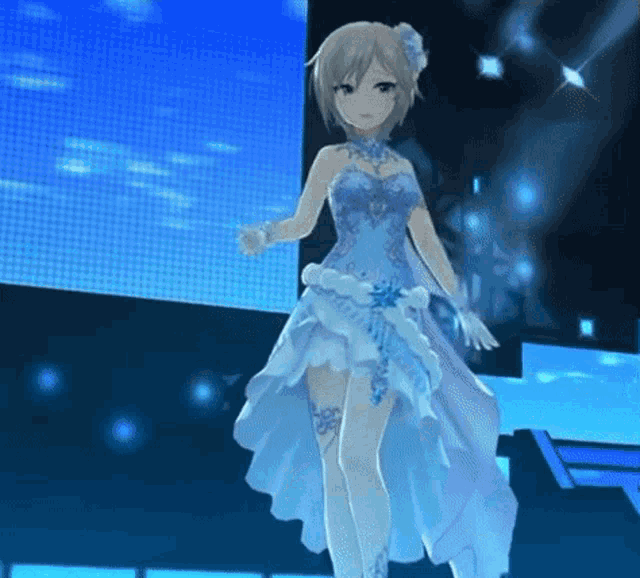 a girl in a blue and white dress is standing on a stage