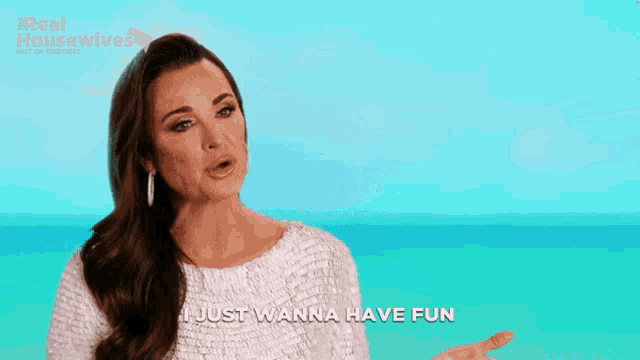 a woman says " i just wanna have fun " while wearing a white top