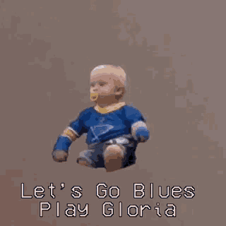 a baby wearing a blues jersey is jumping in the air