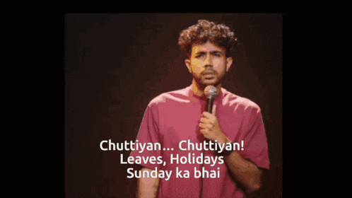 a man stands in front of a microphone and says " chuttyan "