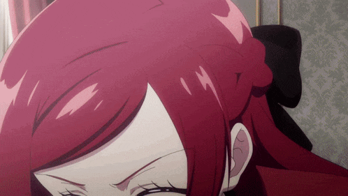 a close up of a woman with red hair and a black bow in her hair