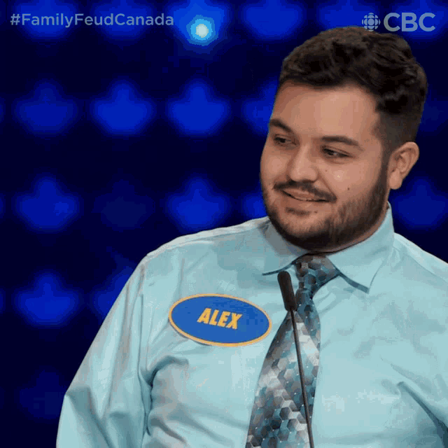 a man wearing a name tag that says alex