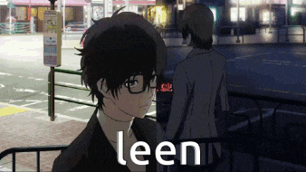 a man with glasses is standing next to another man with the word leen written on the bottom