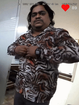 a man in a zebra print shirt has a heart rate of 89 bpm