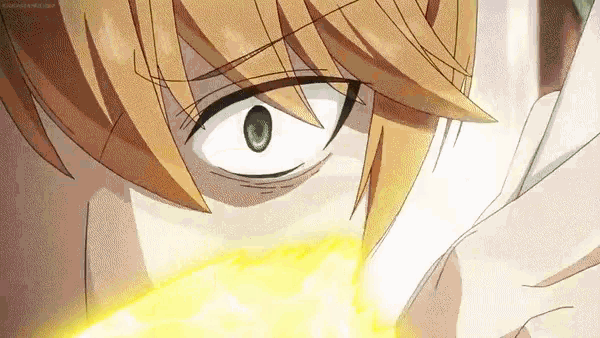 a close up of a person 's face with a yellow light coming out of their eye .