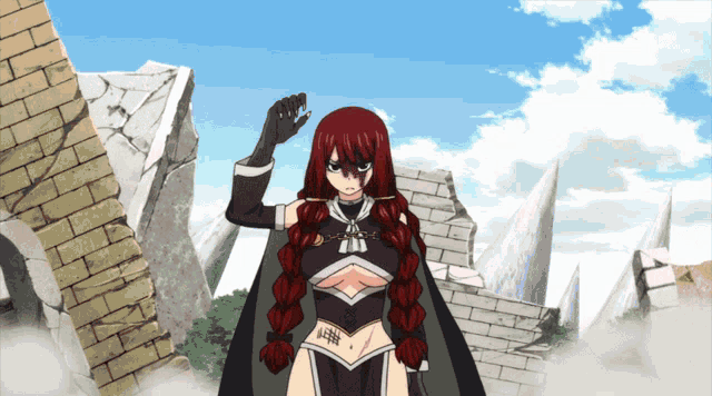a girl with red hair is standing in front of a brick wall and a cliff