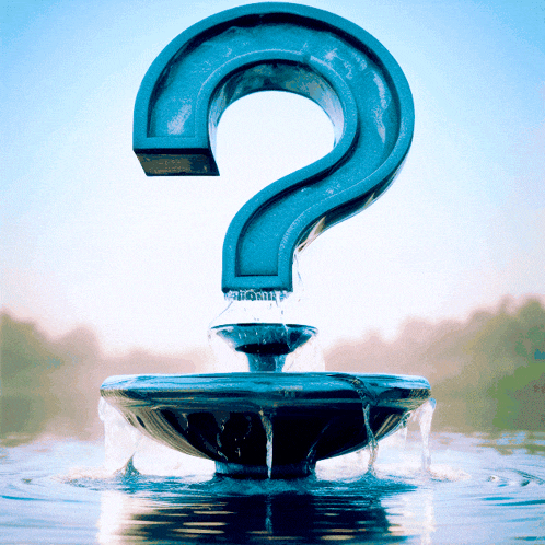 a water fountain with a question mark on it
