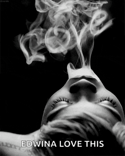 a woman is smoking a cigarette with smoke coming out of her mouth and the caption edwina love this