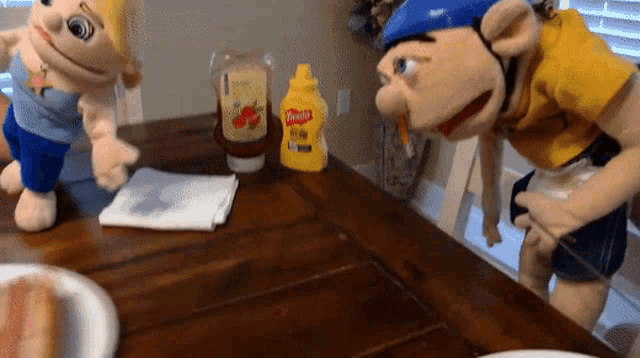 a bottle of mustard sits on a wooden table