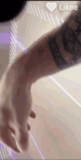 a close up of a person 's arm with a tattoo on it