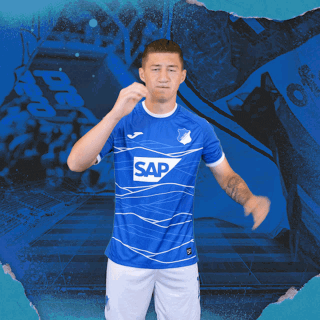 a man wearing a blue shirt with the word sap on the front